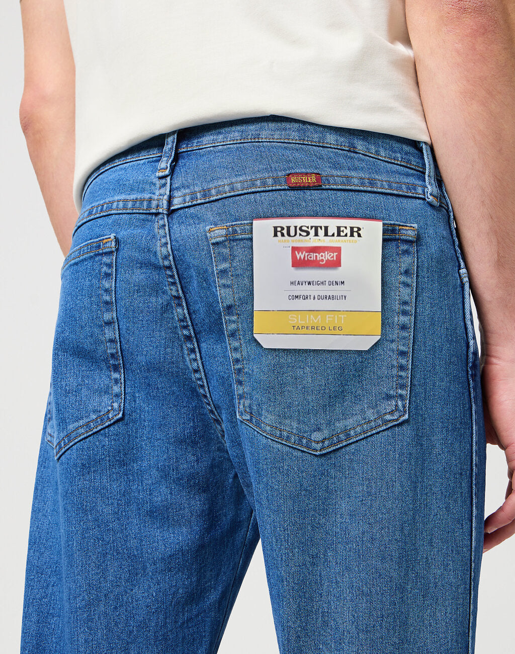 MĘSKIE SPODNIE JEANSOWE WRANGLER RUSTLER SLIM INDIGO MID W10ERC81D 112342563